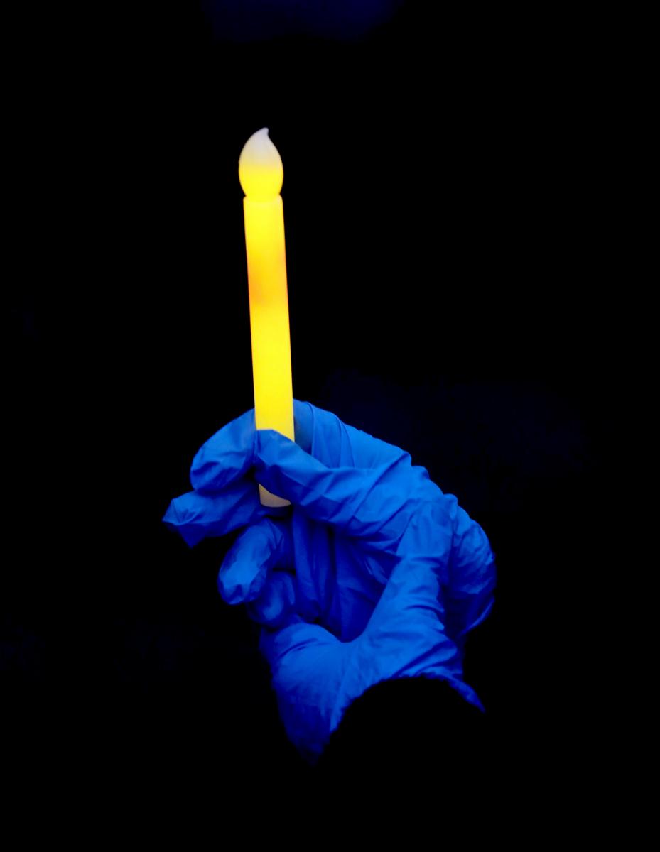 A light is held by a participant during a vigil held by nurses outside Westchester  Medical Center in Valhalla, N.Y. May 6, 2020. 