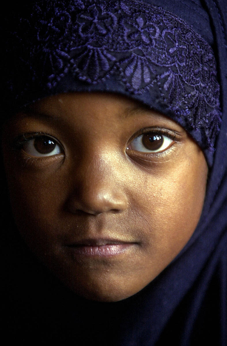 A young girl is photographed in a mosque in the days after the attacks on the World Trade Center in 2001.