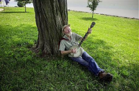 Folk singer and American icon Pete Seeger sitting near near his beloved Hudson River. 